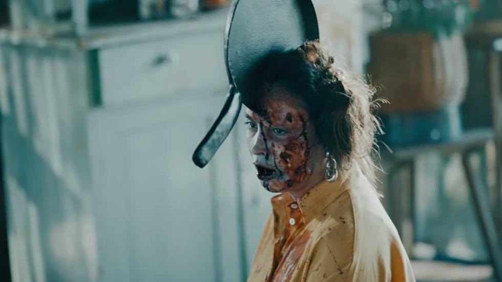The Little One zombie woman with a pan in her head