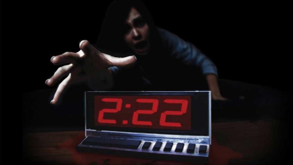 2:22 Woman reaches for her alarm clock