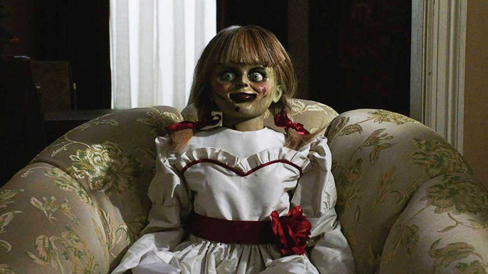 Annabelle sits on a sofa