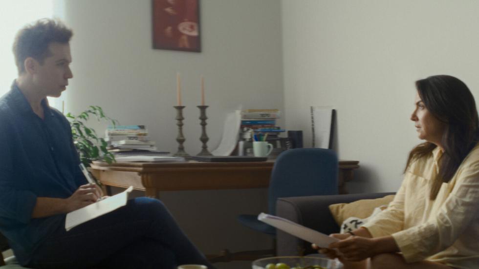 A man and women read a script together