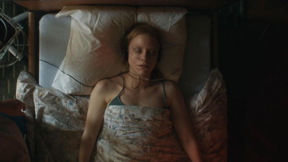 Sick woman sleeps in bed