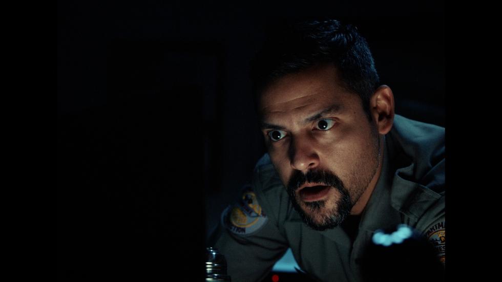 Prison guard stares at something
