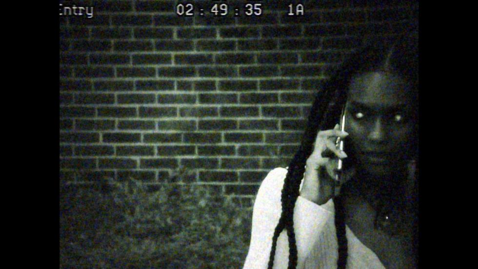 CCTV camera of Carolyn talking on her cell phone at night