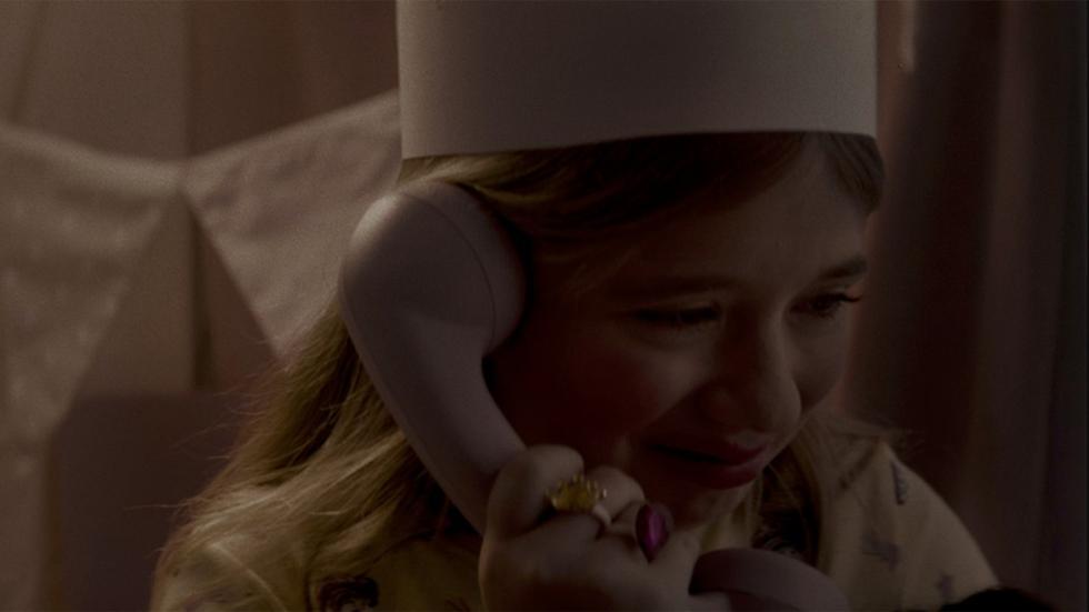 Abracitos film still young girl listening to a phone call
