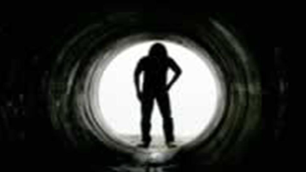 Acolytes figure in a tunnel
