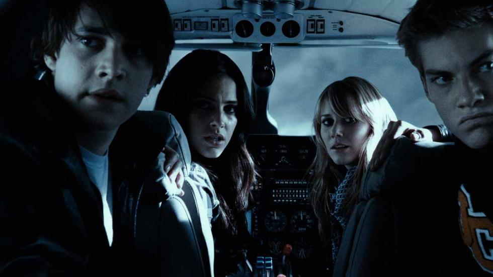 ALTITUDE young people in a plane looking scared