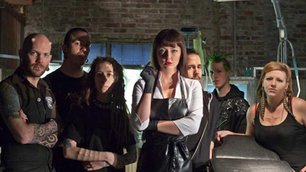 American Mary people standing around a make shift operating room