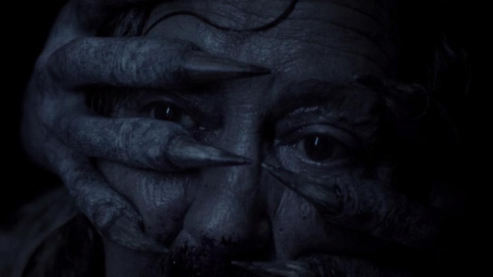 Black Eyed Child (BEC) film still creature hand covers woman's face