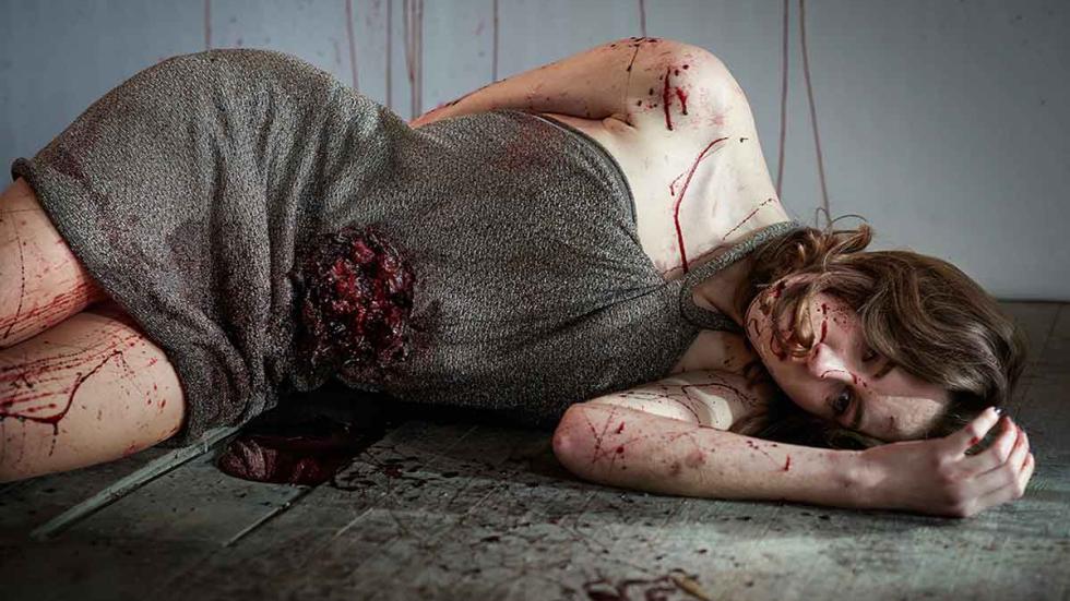 Black Ring film still bloodied woman lies dead