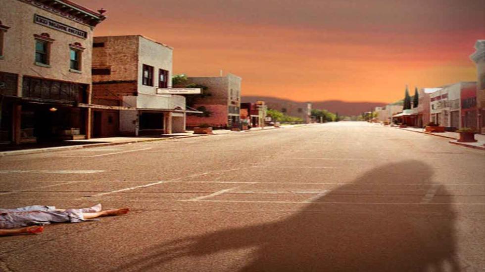Black Gulch dead woman lies on the ground in a deserted town.