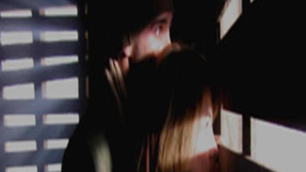 Brumes (Mist) a couple peeks out of a window