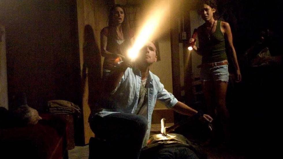 Buried Alive group of people with a flashlight