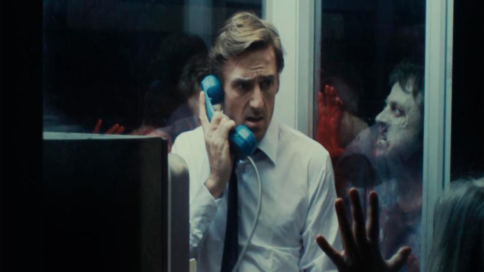 Cabine of the Dead man in a phone booth is surrounded by zombies