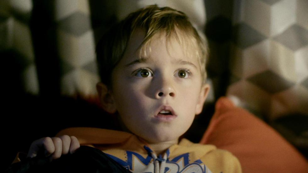 Caravan film still boy looks scared
