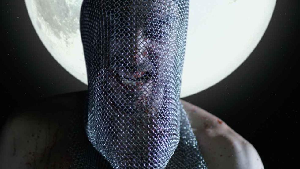 Carne Fresca film still metal mesh masked man