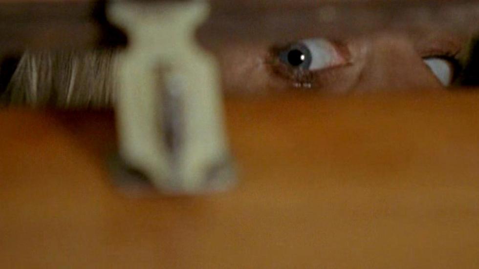 Crawl Space man looks out of locked crawl space