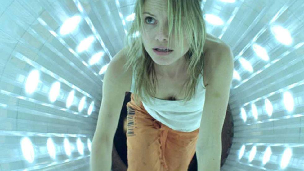 Crawlspace woman crawls through lighted tunnel