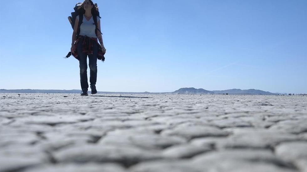 Creeping Darkness film still woman backpacking in the desert