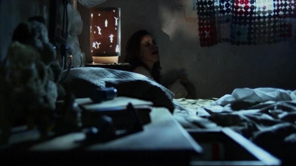 Crowded House woman wakes in bed