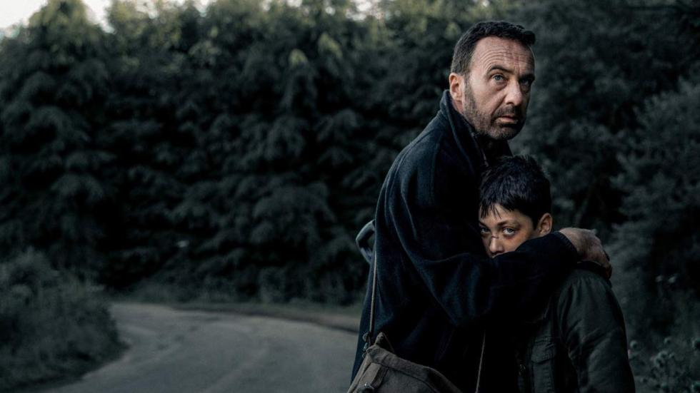 Crowman film still man protects son