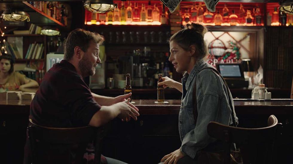 Dana film still couple talking in a bar