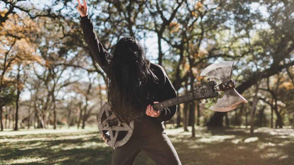 Death Metal film still rocker plays guitar in the park