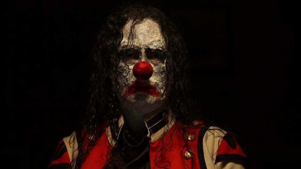 The Deeper You Dig film still clown man with a red nose.