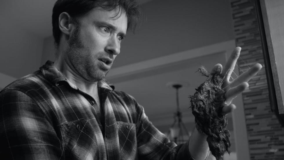 Dementia Part II man holds a dead rat