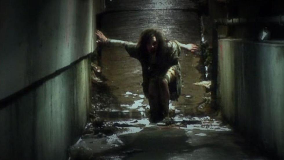 Derailed woman climbs out of trashed underground hallway