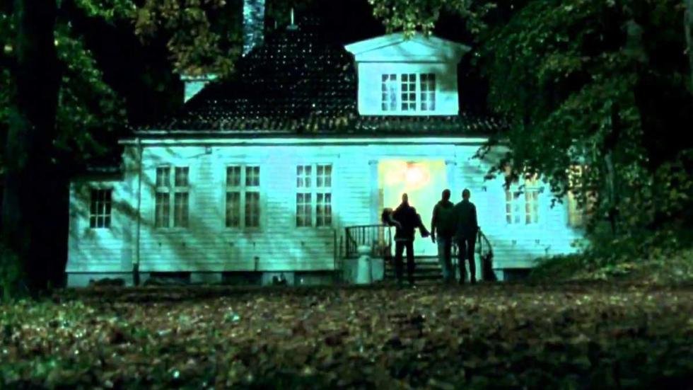 Detour people carrying woman approach a home