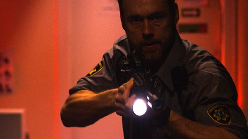 Dark Was the Night man with flashlight