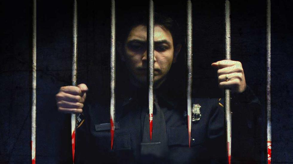 Eater policeman behind bloody bars