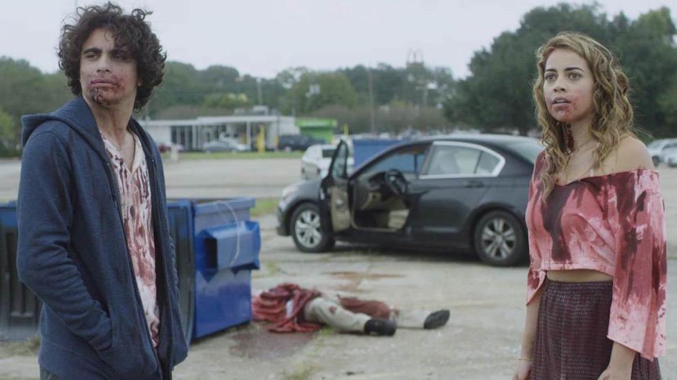Eat Brains Love film still zombies, cars and a couple