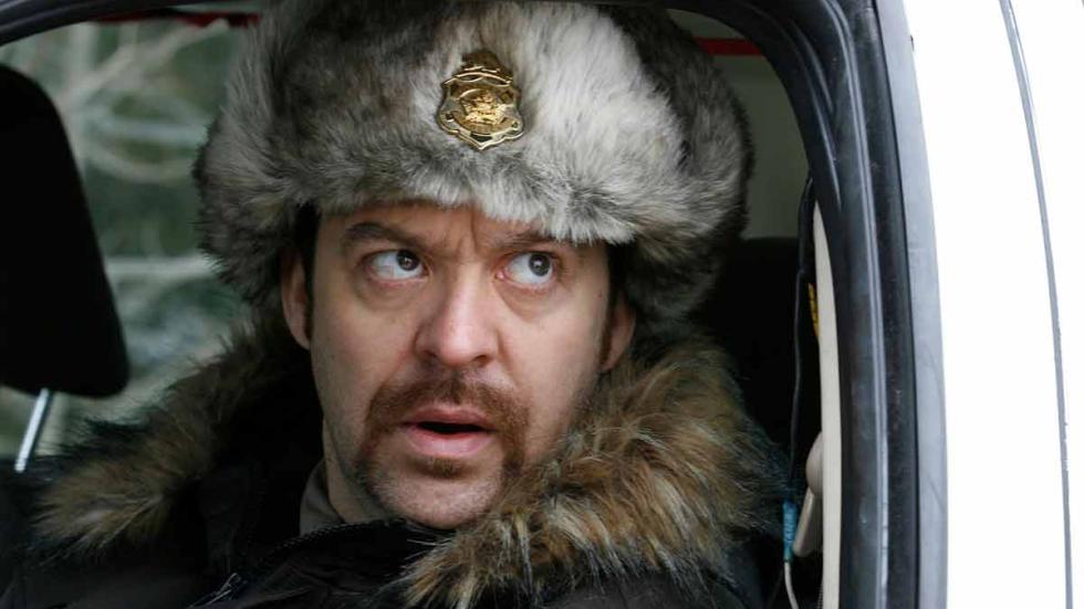 Eddie The Sleepwalking Cannibal policeman looks out car window