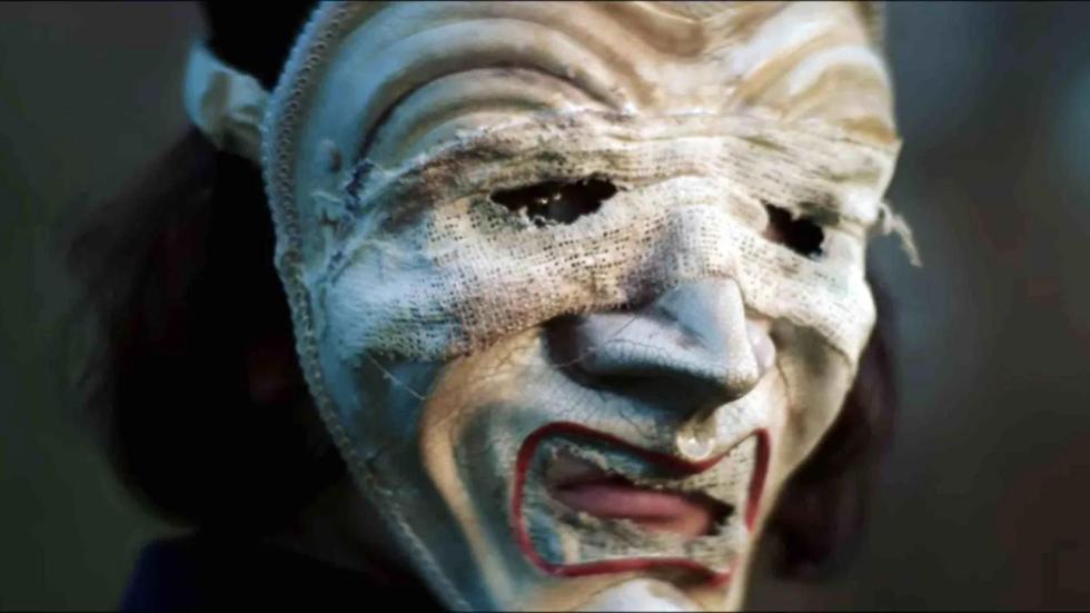 A creepy masked person