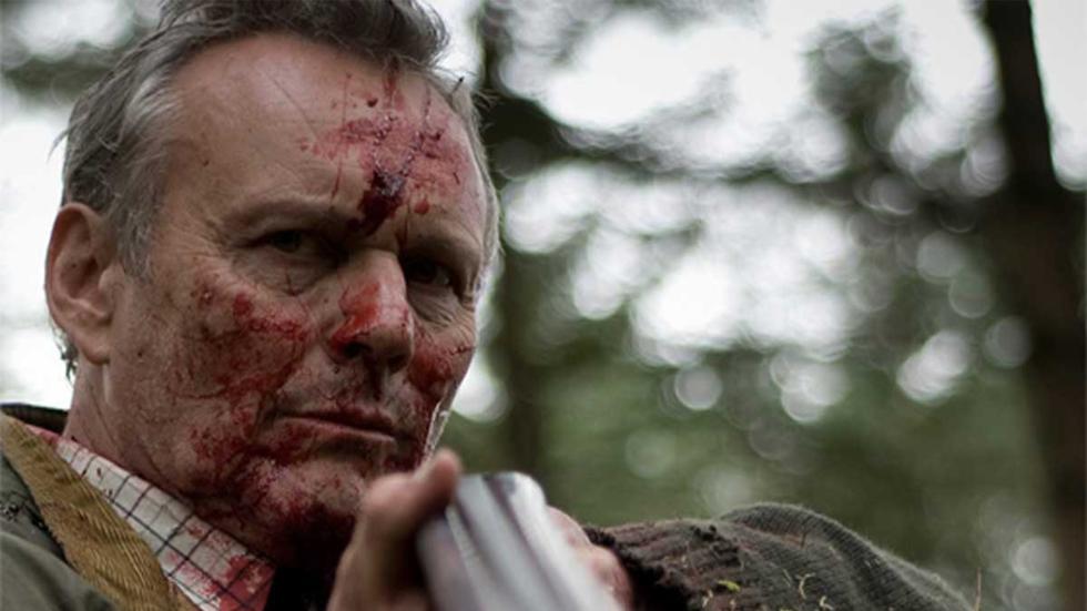 Ella bloodied faced man with gun