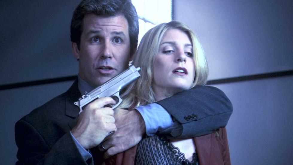 Entity-Nine man holds a gun to a woman