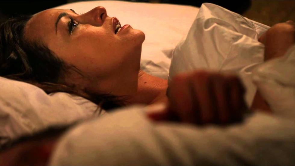 Fade Into You woman laying on bed in fear