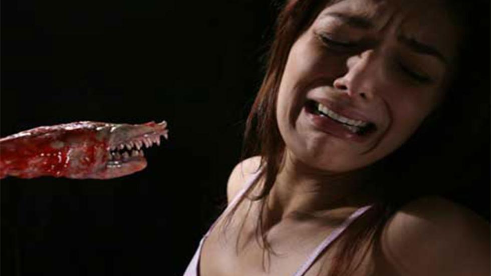 Fallen Angels creature ready to attack scared woman