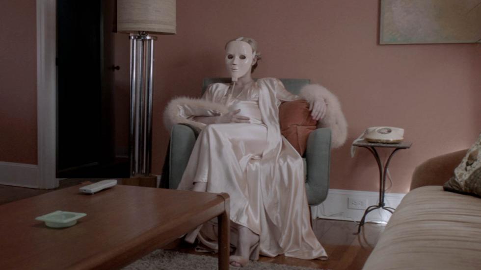 Father of Flies film still woman in face mask