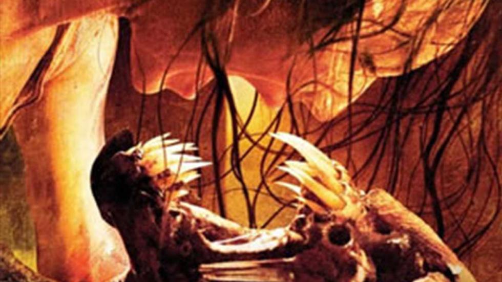 Feast poster still of a woman screaming at a creatures fang teeth in her face