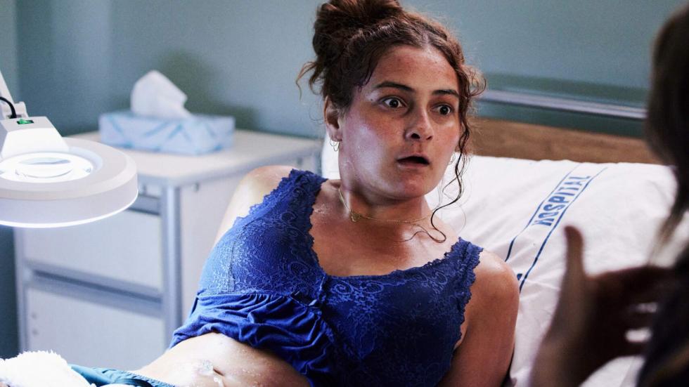 Mary looks frightened after having an ultrasound on her pregnant belly