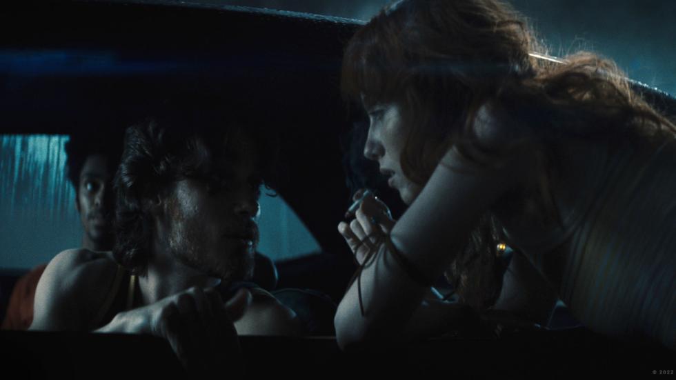 Young people smoking in and around a car