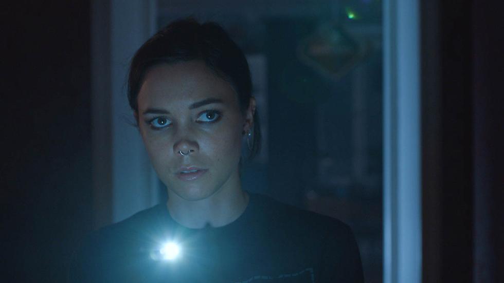 FIRST LIKE film still woman with a flashlight
