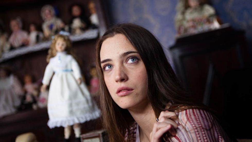 Para Elisa woman looks on with dolls in the background
