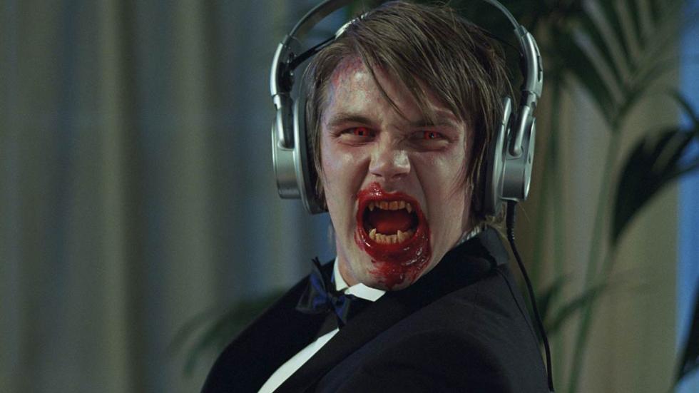Frostbitten bloody faced man with headphones screams