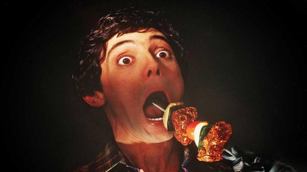 Happy Birthday To Me man's mouth being stabbed with a shish kabob