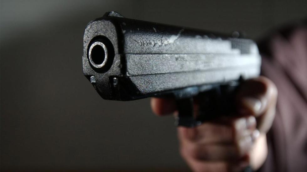 Headshot gun pointed