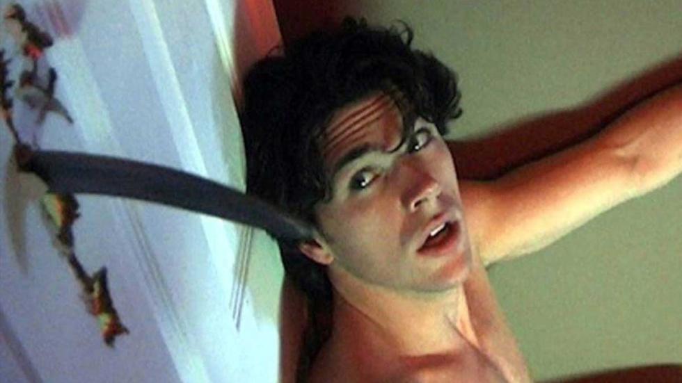 Hellbent a guy hides behind a door that an intruder stabs a knife through