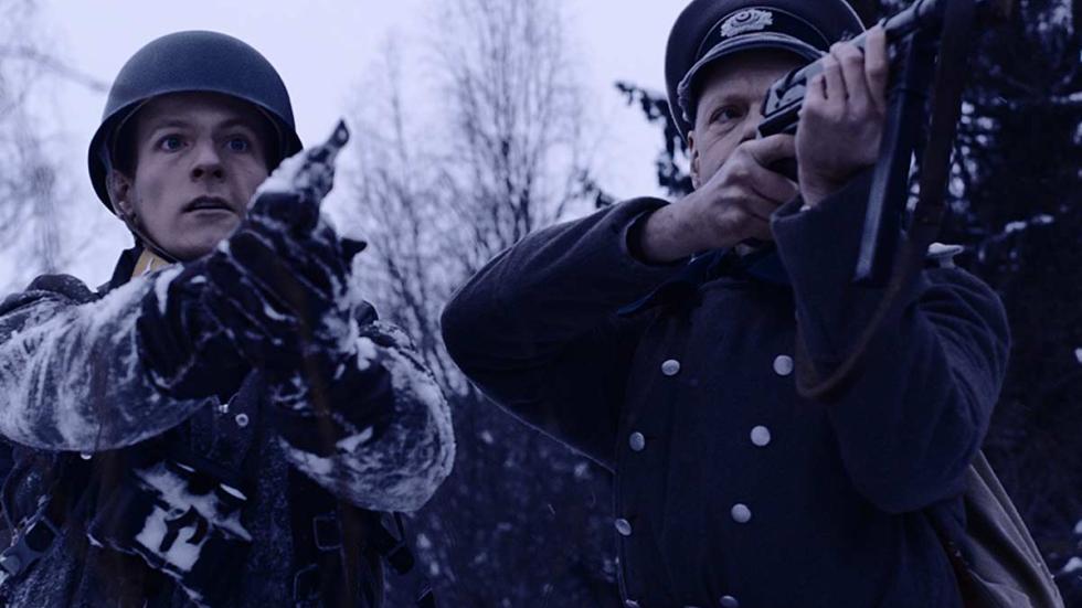 The House film still military men with their guns 